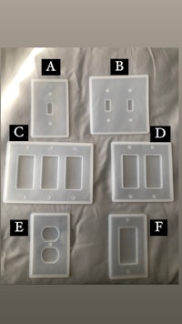 a set of plastic switch plates with different numbers on them