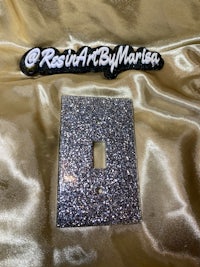 a silver glitter light switch cover